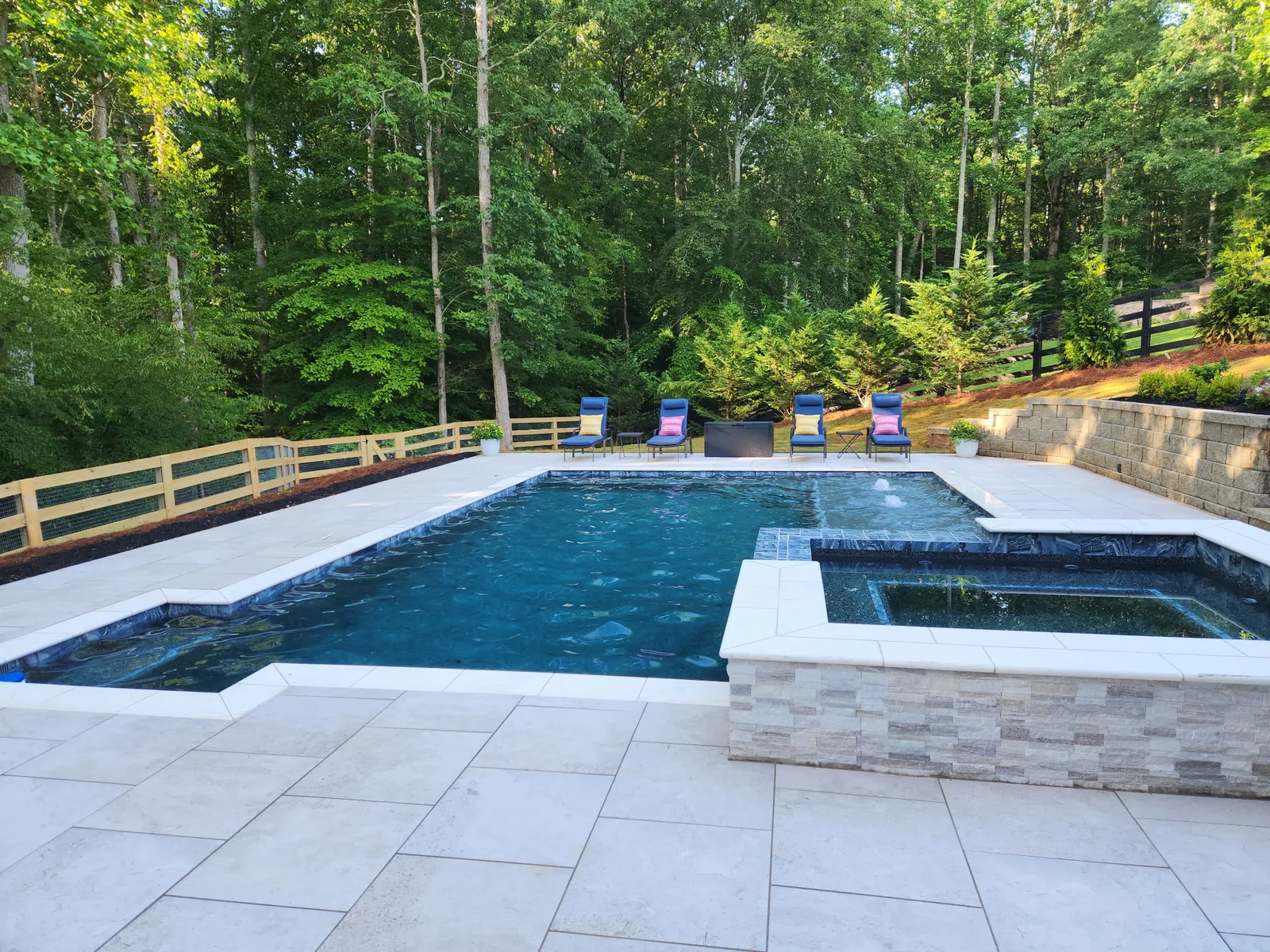 Pool and spa set in a private wooded backyard